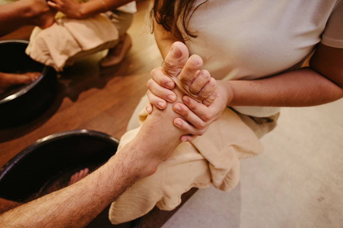 woman applying foot mask for super dry feet at home with moisturized heels